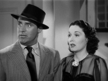 Movie still from “My Favorite Wife” (1940), directed by Garson Kanin – A man and a woman standing next to each other; Close Up shot, Low angle
