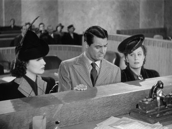 Movie still from “My Favorite Wife” (1940), directed by Garson Kanin – A man and two women are sitting in a court room; Medium shot, High angle