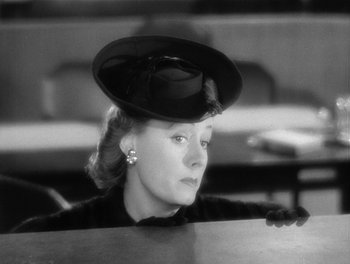 Movie still from “My Favorite Wife” (1940), directed by Garson Kanin – A black and white photo of a woman wearing a hat; Close Up shot, Low angle
