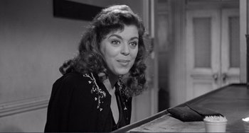 Movie still from “My Gun Is Quick” (1957), directed by Victor Saville – A black - and - white photo of a young woman; Close Up shot, High angle