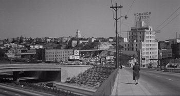 Movie still from “My Gun Is Quick” (1957), directed by Victor Saville – An old black and white photo of a city street; Extreme Wide shot, High angle