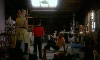 Movie still from “My Life as a Dog” (1985), directed by Lasse Hallström – A group of people in a room with a painting; Wide shot, Over the shoulder angle