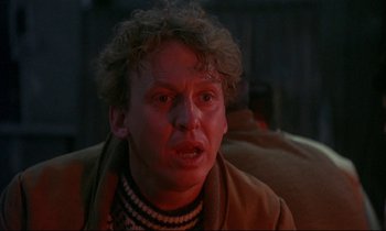 Movie still from “My Life as a Dog” (1985), directed by Lasse Hallström – A person wearing a jacket; Close Up shot, Over the shoulder angle