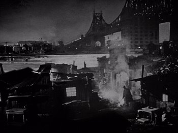 Movie still from “My Man Godfrey” (1936), directed by Gregory La Cava – A black and white photo of a city at night; Extreme Wide shot, High angle