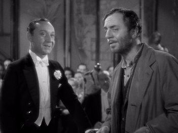 Movie still from “My Man Godfrey” (1936), directed by Gregory La Cava – Two men in tuxedos standing next to each other; Medium shot, Over the shoulder angle
