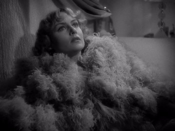 Movie still from “My Man Godfrey” (1936), directed by Gregory La Cava – An old photo of a woman in a fur coat; Close Up shot, High angle