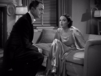 Movie still from “My Man Godfrey” (1936), directed by Gregory La Cava – A man and a woman sitting on a couch talking; Medium shot, High angle