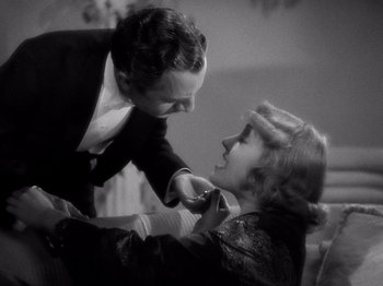 Movie still from “My Man Godfrey” (1936), directed by Gregory La Cava – A man and a woman in formal wear touching each other; Close Up shot, High angle