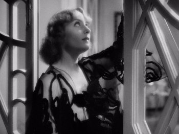 Movie still from “My Man Godfrey” (1936), directed by Gregory La Cava – An old photo of a woman looking out of a window; Close Up shot, Low angle