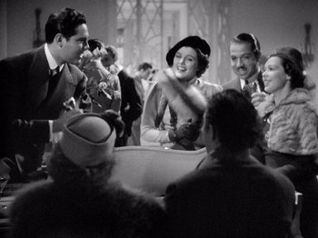 Movie still from “My Man Godfrey” (1936), directed by Gregory La Cava – A group of people sitting around a room; Medium shot, High angle
