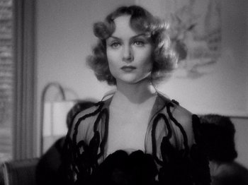 Movie still from “My Man Godfrey” (1936), directed by Gregory La Cava – A black and white photo of a woman in a dress; Close Up shot, Low angle