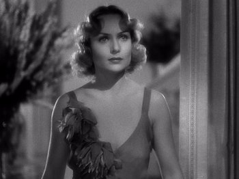 Movie still from “My Man Godfrey” (1936), directed by Gregory La Cava – An old photo of a woman in a dress; Close Up shot, Over the shoulder angle