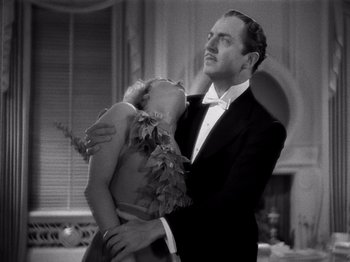 Movie still from “My Man Godfrey” (1936), directed by Gregory La Cava – A man and a woman in formal wear embracing; Medium shot, Low angle