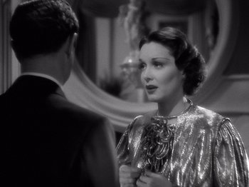 Movie still from “My Man Godfrey” (1936), directed by Gregory La Cava – An old photo of a man and a woman; Close Up shot, Over the shoulder angle