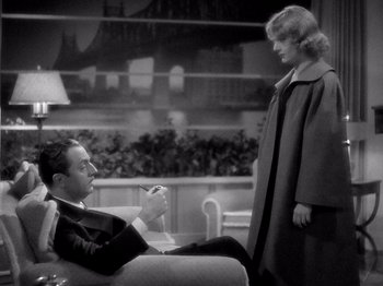 Movie still from “My Man Godfrey” (1936), directed by Gregory La Cava – A man and a woman are sitting on a couch; Medium shot, High angle
