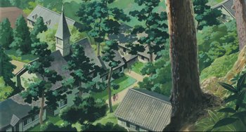 Movie still from “My Neighbor Totoro” (1988), directed by Hayao Miyazaki – An aerial view of a town with a church in the background; Extreme Wide shot, High angle