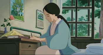 Movie still from “My Neighbor Totoro” (1988), directed by Hayao Miyazaki – An animated woman writing on a piece of paper; Medium shot, High angle