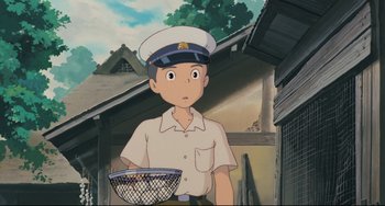 Movie still from “My Neighbor Totoro” (1988), directed by Hayao Miyazaki – An animated picture of a man holding a basket of food; Medium shot, Low angle