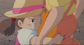 Movie still from “My Neighbor Totoro” (1988), directed by Hayao Miyazaki – An animated picture of a boy and a woman; Extreme Close Up shot, High angle