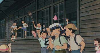 Movie still from “My Neighbor Totoro” (1988), directed by Hayao Miyazaki – A group of people standing next to each other on steps; Wide shot, High angle