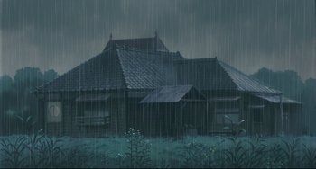 Movie still from “My Neighbor Totoro” (1988), directed by Hayao Miyazaki – An image of a house in the middle of the night in the rain; Extreme Wide shot, Low angle