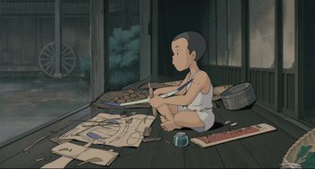 Movie still from “My Neighbor Totoro” (1988), directed by Hayao Miyazaki – A child sitting on the ground with a pair of scissors; Wide shot, High angle