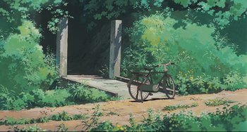 Movie still from “My Neighbor Totoro” (1988), directed by Hayao Miyazaki – A bicycle parked on a dirt path near a bridge; Extreme Wide shot, Low angle