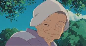 Movie still from “My Neighbor Totoro” (1988), directed by Hayao Miyazaki – An old man with a white hat is smiling for the camera; Close Up shot, Low angle