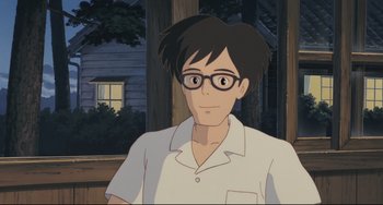 Movie still from “My Neighbor Totoro” (1988), directed by Hayao Miyazaki – A man with glasses is standing in front of a house; Close Up shot, Low angle