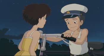 Movie still from “My Neighbor Totoro” (1988), directed by Hayao Miyazaki – A couple of people that are standing up together; Medium shot, Low angle