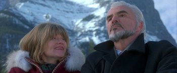 Movie still from “Mystery, Alaska” (1999), directed by Jay Roach – An older man and a younger woman looking up at the sky; Close Up shot, Low angle