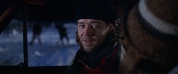 Movie still from “Mystery, Alaska” (1999), directed by Jay Roach – A person wearing a jacket and hat; Close Up shot, Over the shoulder angle