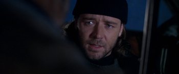 Movie still from “Mystery, Alaska” (1999), directed by Jay Roach – A person wearing a hat; Close Up shot, Over the shoulder angle