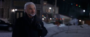 Movie still from “Mystery, Alaska” (1999), directed by Jay Roach – An older man in a black jacket and gloves; Close Up shot, Over the shoulder angle