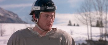 Movie still from “Mystery, Alaska” (1999), directed by Jay Roach – A person with a helmet on; Close Up shot, Low angle