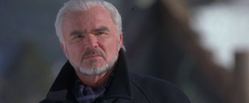 Movie still from “Mystery, Alaska” (1999), directed by Jay Roach – An older man with white hair and a gray beard; Close Up shot, Low angle