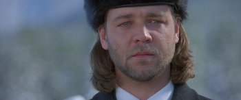 Movie still from “Mystery, Alaska” (1999), directed by Jay Roach – A person wearing a hat; Close Up shot, Over the shoulder angle