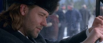Movie still from “Mystery, Alaska” (1999), directed by Jay Roach – A person wearing a fur hat; Close Up shot, Over the shoulder angle