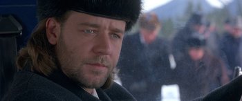 Movie still from “Mystery, Alaska” (1999), directed by Jay Roach – A person wearing a hat; Close Up shot, Over the shoulder angle