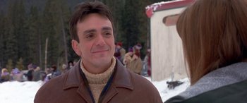 Movie still from “Mystery, Alaska” (1999), directed by Jay Roach – A person wearing a jacket; Close Up shot, Over the shoulder angle