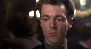 Movie still from “Naked” (1993), directed by Mike Leigh – A man's face in the dark; Close Up shot, Low angle