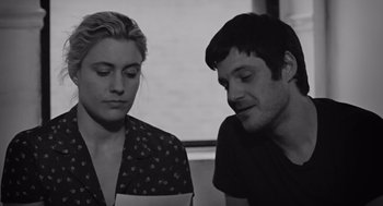 Movie still from “Frances Ha” (2012), directed by Noah Baumbach – A man and a woman sitting next to each other; Close Up shot, Over the shoulder angle