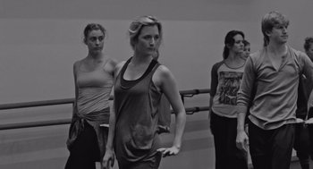 Movie still from “Frances Ha” (2012), directed by Noah Baumbach – A group of women standing next to each other in a room; Medium shot, Low angle