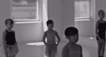 Movie still from “Frances Ha” (2012), directed by Noah Baumbach – Two little girls standing next to each other in a room; Close Up shot, Over the shoulder angle