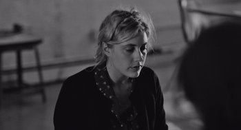Movie still from “Frances Ha” (2012), directed by Noah Baumbach – Black and white photograph of a young woman looking to her left; Close Up shot, High angle