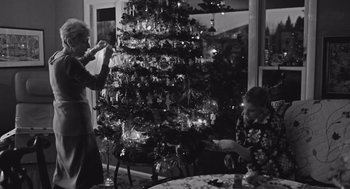 Movie still from “Frances Ha” (2012), directed by Noah Baumbach – Two women in front of a decorated christmas tree; Medium shot, Low angle