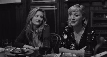 Movie still from “Frances Ha” (2012), directed by Noah Baumbach – Two women sitting at a table with a glass of red wine; Close Up shot, Over the shoulder angle
