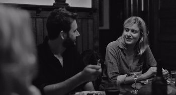 Movie still from “Frances Ha” (2012), directed by Noah Baumbach – A man and a woman sitting at a dinner table; Medium shot, Over the shoulder angle