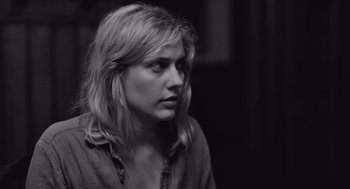 Movie still from “Frances Ha” (2012), directed by Noah Baumbach – Black and white photograph of a woman looking at the camera; Close Up shot, Over the shoulder angle