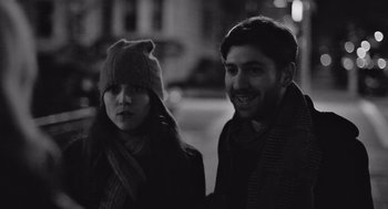 Movie still from “Frances Ha” (2012), directed by Noah Baumbach – A man and a woman standing next to each other; Close Up shot, Over the shoulder angle